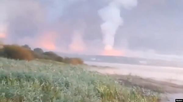 Smoke and flames rise following a Ukrainian drone attack, amid the Russia-Ukraine conflict, in Toropets, Tver region, Russia Sept.18, 2024, in this screen grab obtained from a social media video. 